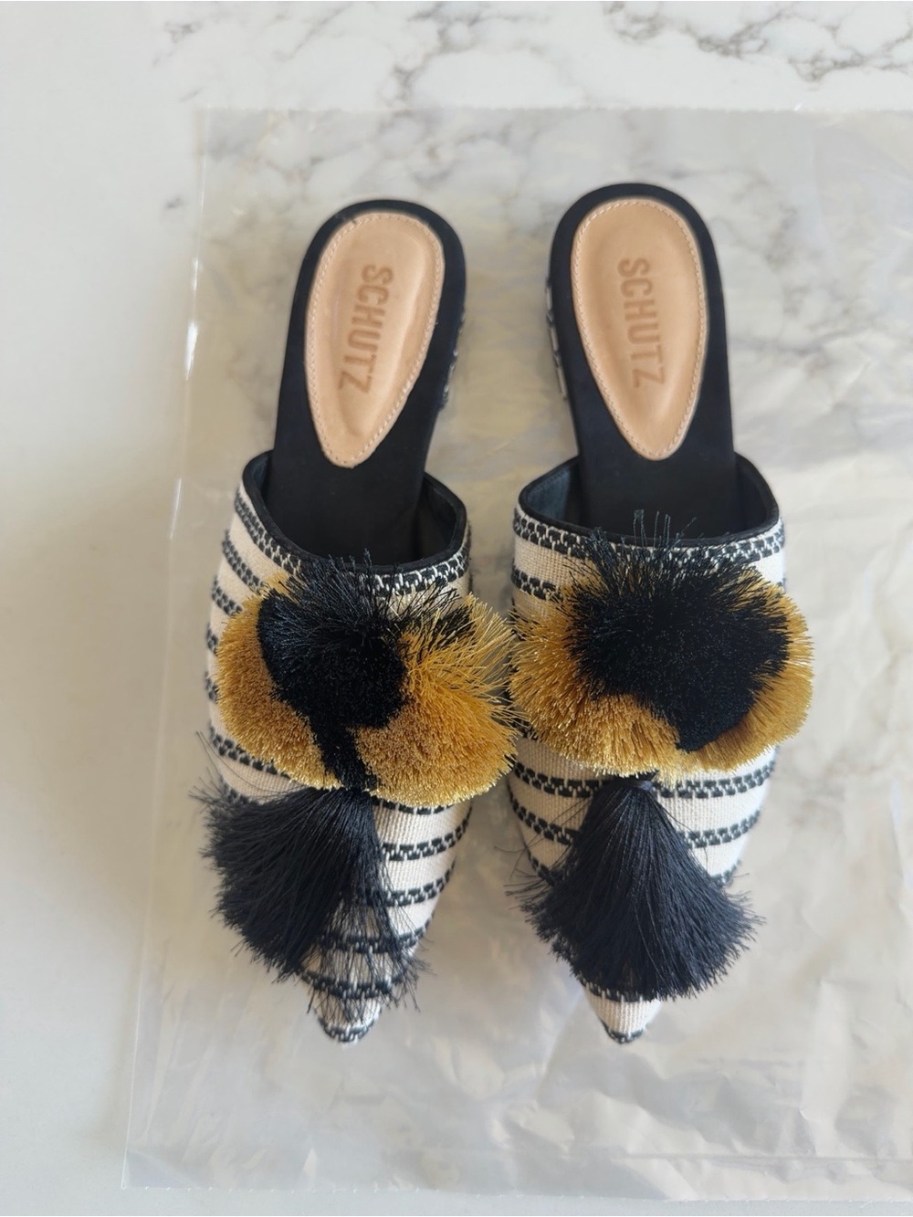 SCHUTZ Black and Gold Pointed Pom-Pom Slip-On Mules